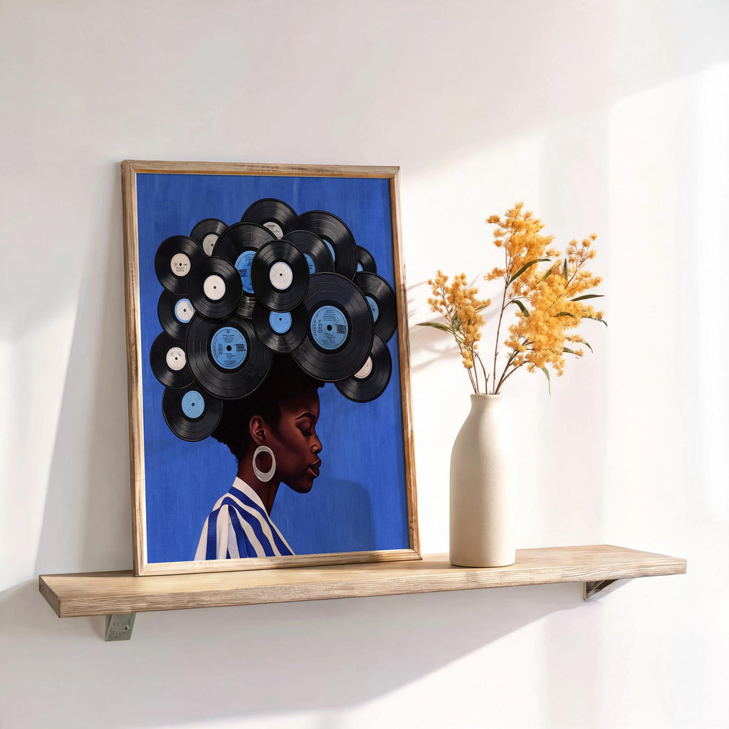 Blue framed print on shelf with dried flowers, layered vinyl records and cool tones, modern boho black woman vinyl record wall art