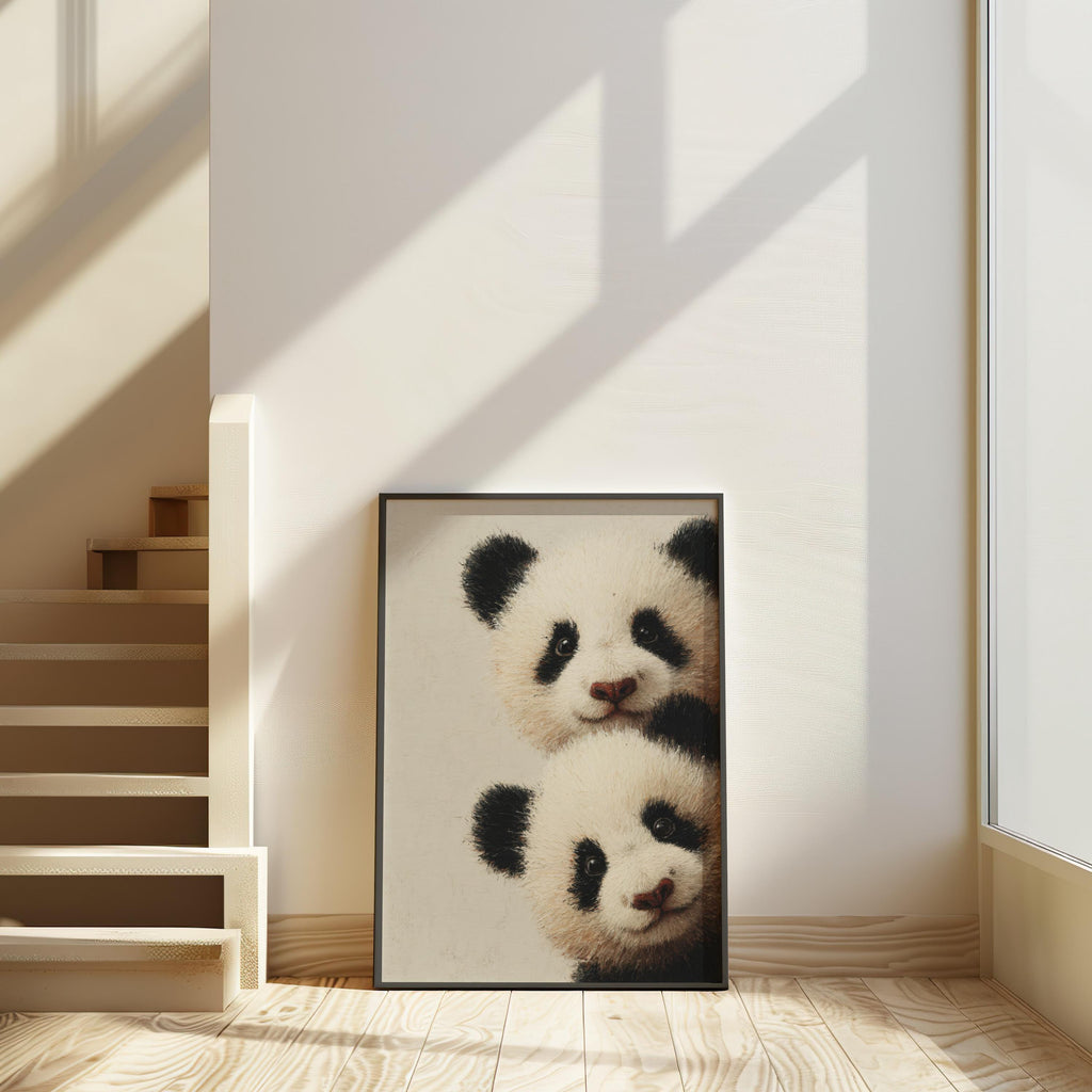 Baby pandas wall art: two giant panda cubs peeking from the edge in a light-wood framed print for baby panda nursery decor.