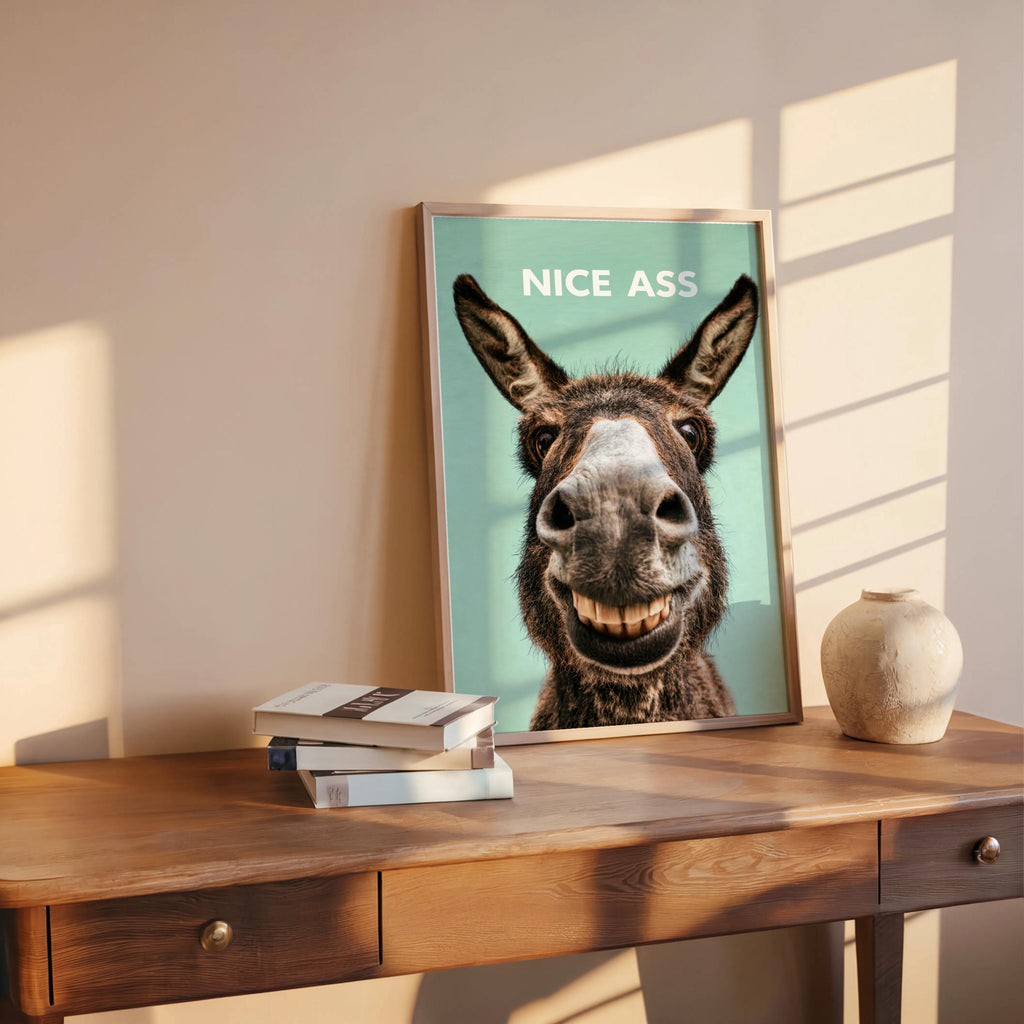 Seafoam green funny donkey bathroom sign on shelf with books, donkey face close-up, ideal funny bathroom wall art
