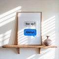 Framed couples text message print leaning on shelf, textured white background, bright blue "Always" speech bubble.