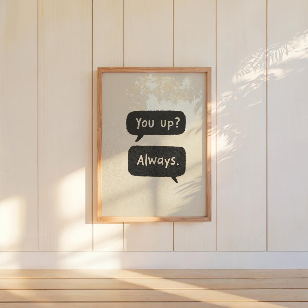 Framed neutral couples text message print mounted on wall, bold black speech bubbles, minimalist funny couples wall art look.
