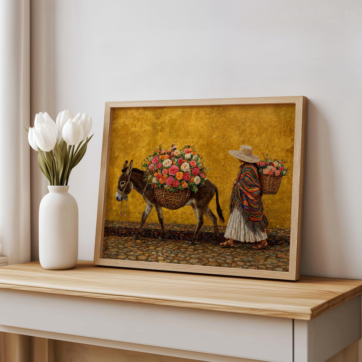 Floral mexican art print leaning on table, golden yellow background, textured oil effect, mexican woman and donkey art