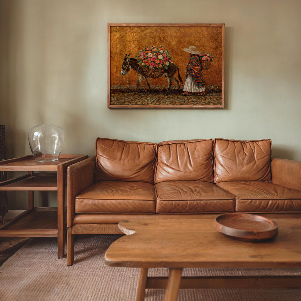 Mexican market wall art above sofa, warm ochre backdrop, vintage distressed texture, donkey carrying bright blooms