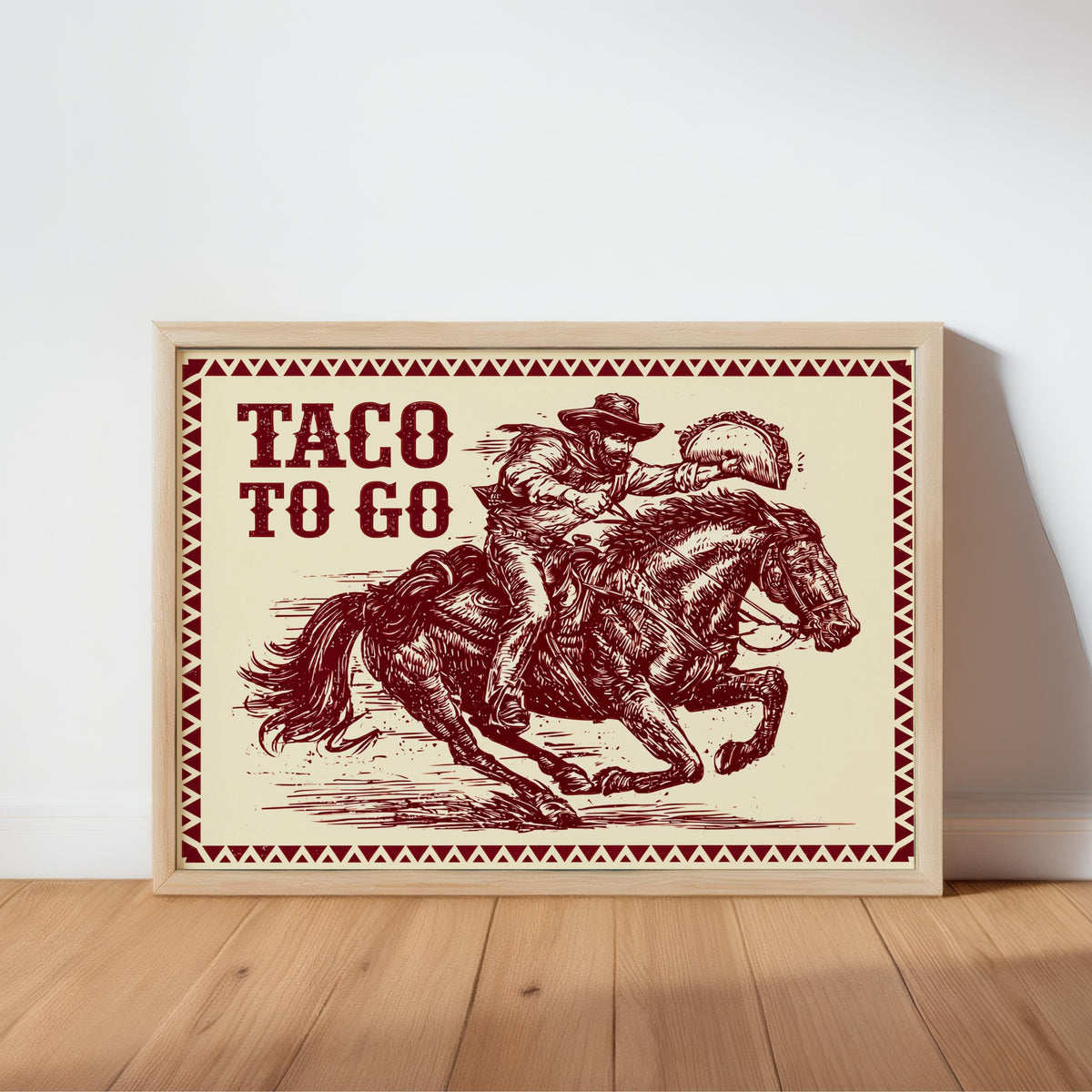 Crimson red engraved cowboy and tacos print, framed and propped on floor, quirky cowboy art print for kitchens