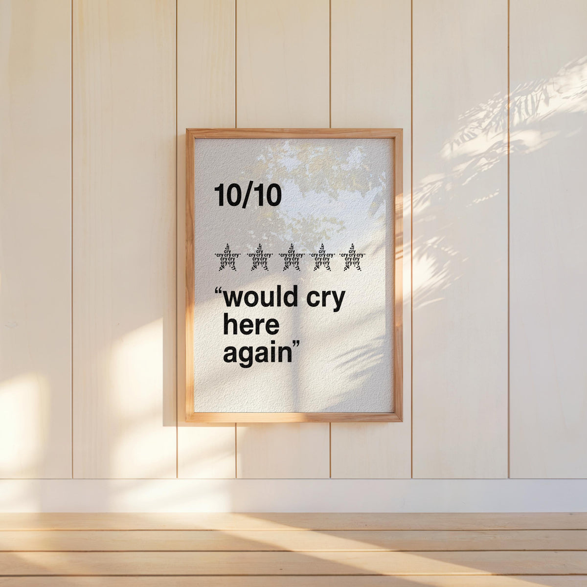 Cream would cry here again print hanging on panelled wall, subtle sunlight, perfect mental health quote print for office