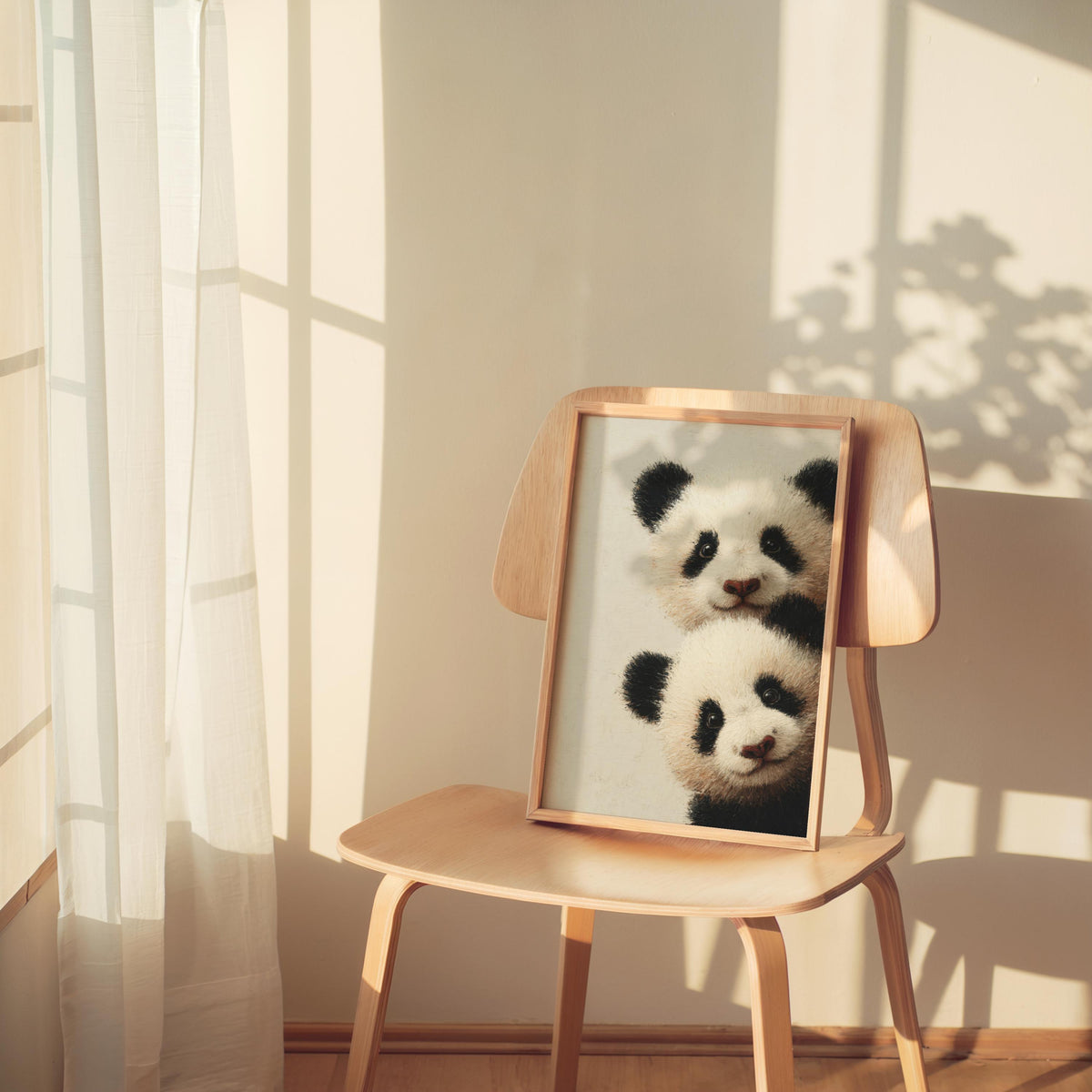 Baby pandas wall art: two giant panda cubs peeking from the edge in a light-wood framed print for baby panda nursery decor.