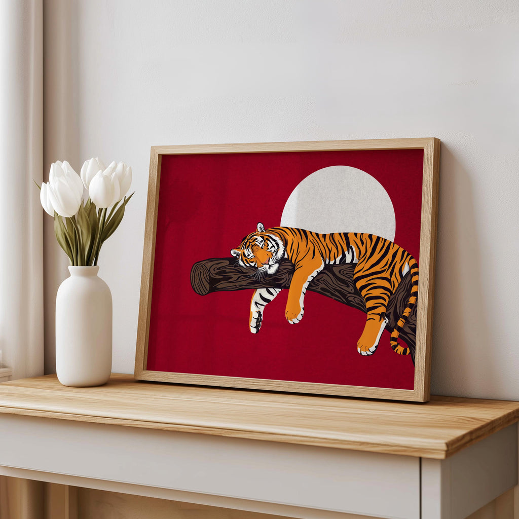 Red sleeping tiger wall art on shelf with vase, bold vintage-inspired tiger on branch art, framed