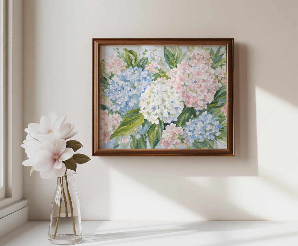 English country wall art hung above side table, framed pastel hydrangea print with delicate vase bloom