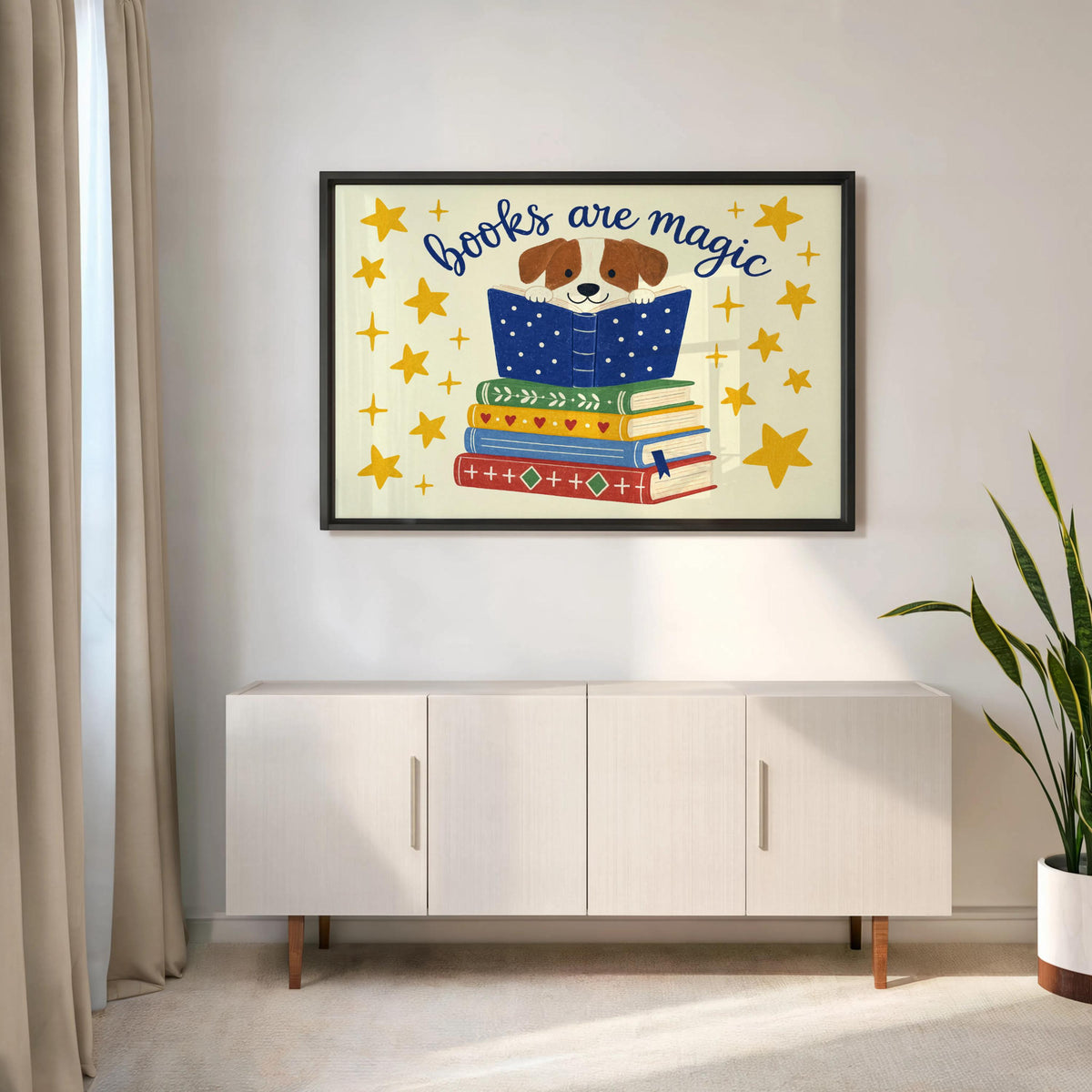 Dog reading wall art framed above midcentury console, potted plant and clean lines, stylish book lover wall art