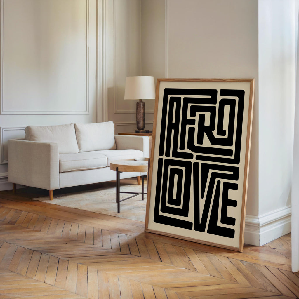 Afro Love wall art large frame propped in a bright doorway, hardwood floors, minimalist Black wall art display