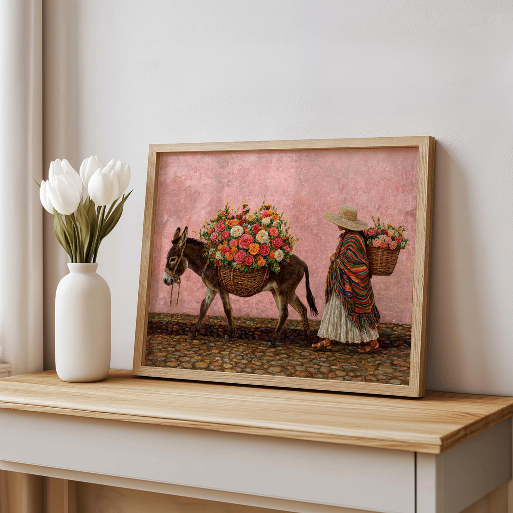 Mexican folk art print leaning on shelf, soft pink background, lively floral bouquet on donkey, vintage rustic finish