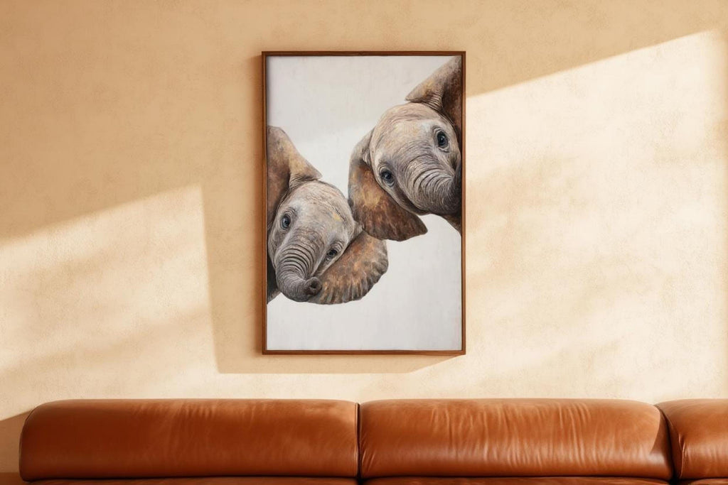 Tall framed safari nursery wall art hung over leather sofa, whimsical elephant nursery art in warm tones