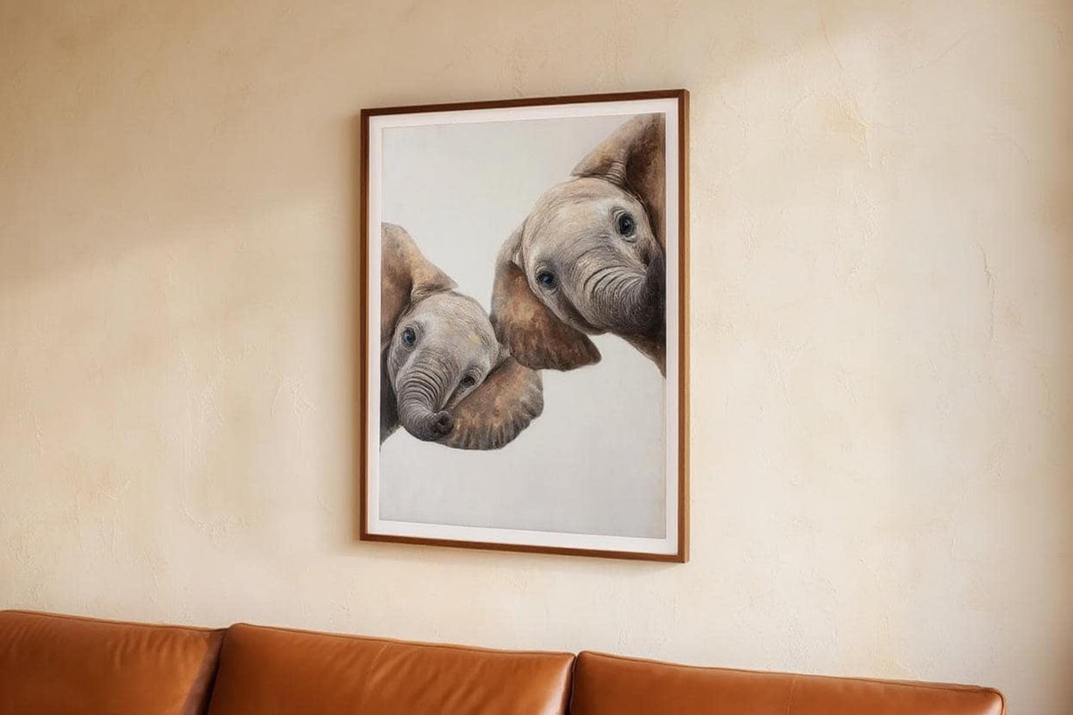 Vertical framed safari nursery wall art above couch, cute peeking elephants, mid-century modern neutral vibe
