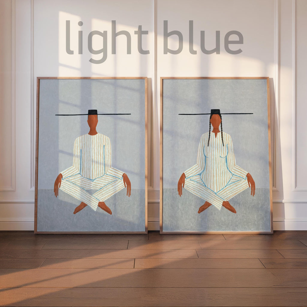 Soft light blue variant, two framed meditating figure art prints displayed as a balanced meditation wall art set