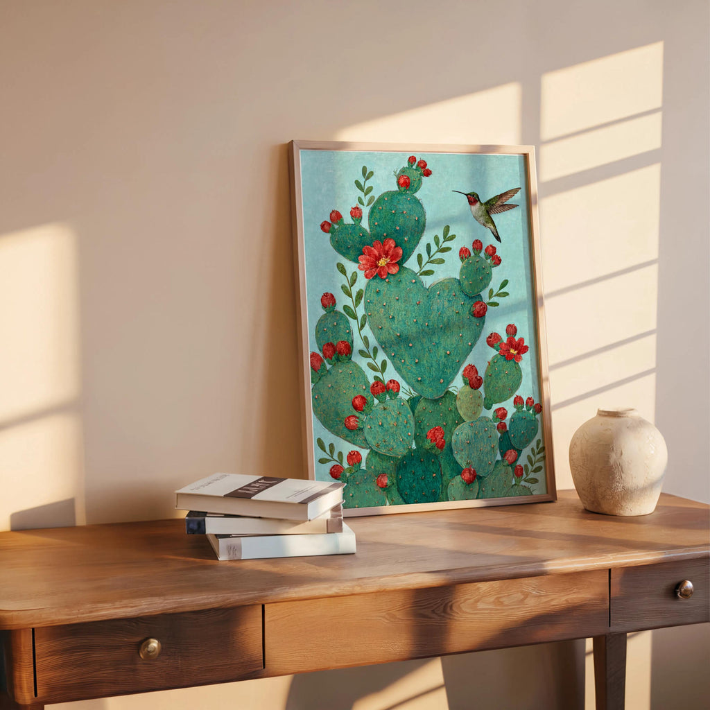 Centered heart shaped cactus print by stairs, teal wall light, romantic cactus art with red floral accents