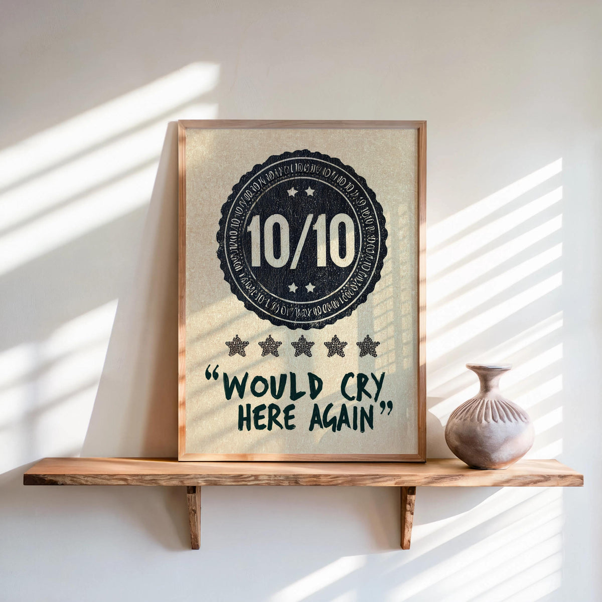Navy would cry here again print leaning on a shelf, distressed 10/10 badge, soft sunlit stripes