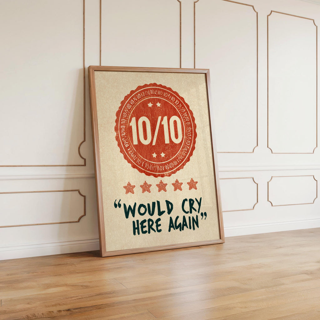 Floor level orange would cry here again print leaning against decorative molding, casual shelfless display