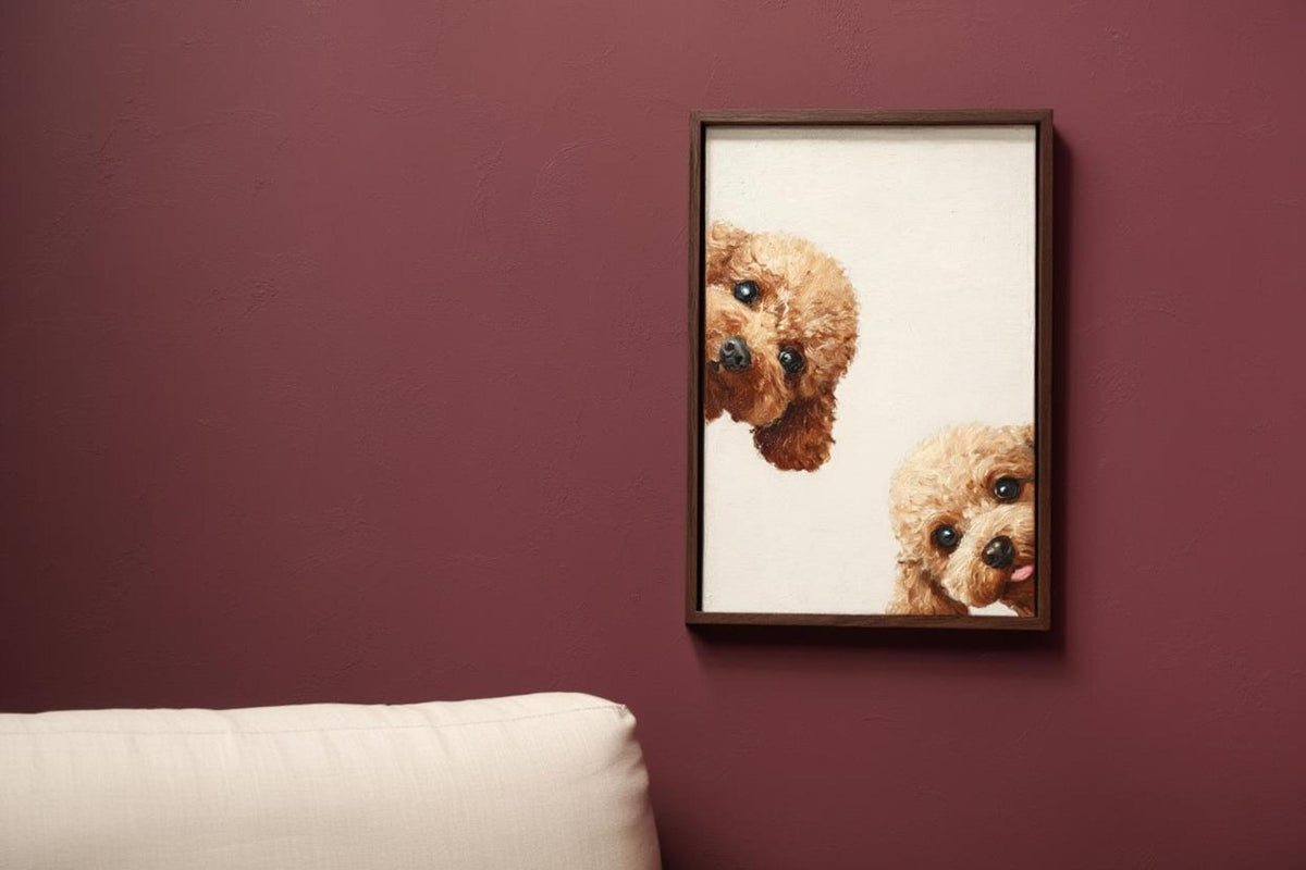 Burgundy accent wall with hung goldendoodle wall art printable, two curly faces brighten modern decor