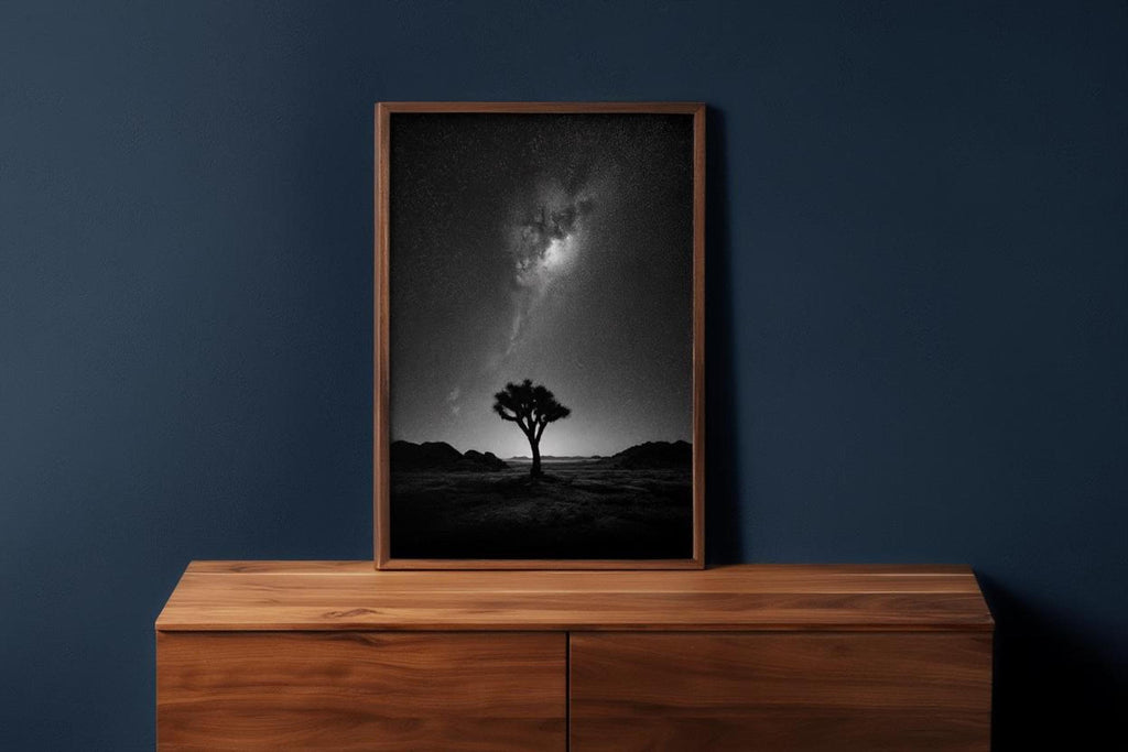 Framed joshua tree milky way print on a wooden console, navy wall backdrop, southwestern boho styling