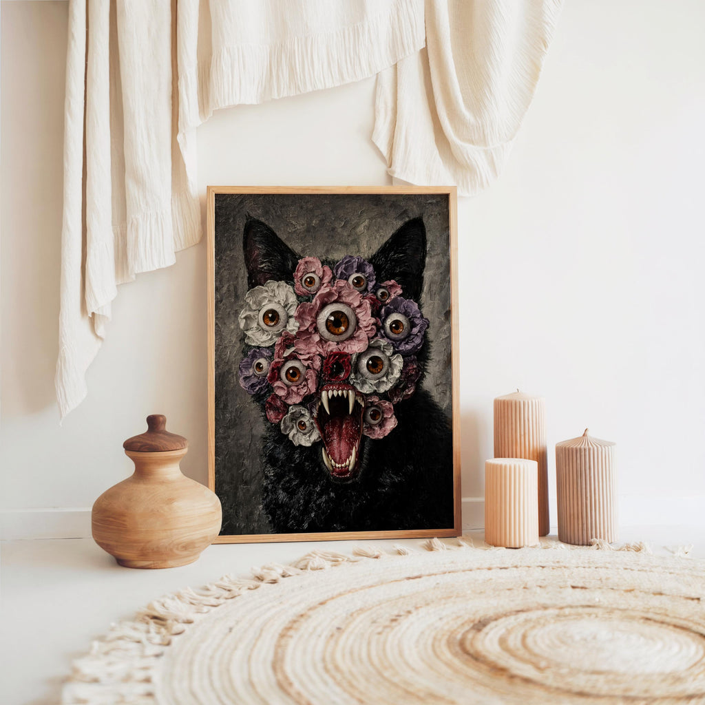 Horror-inspired home decor print set on floor near woven rug and pottery, moody black cat floral wall art scene
