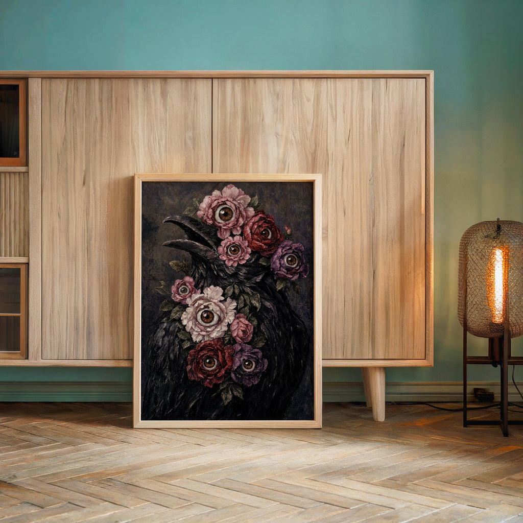 Surreal raven art print leaned against a teal-accent wall, warm lamp glow, witchy wall decor mood