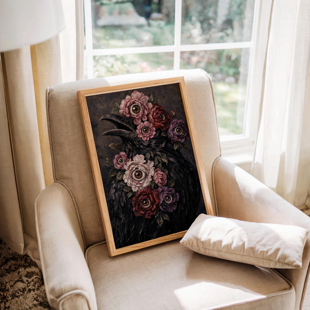 Surreal raven art print resting on an upholstered chair by a bright window, weirdcore art print energy