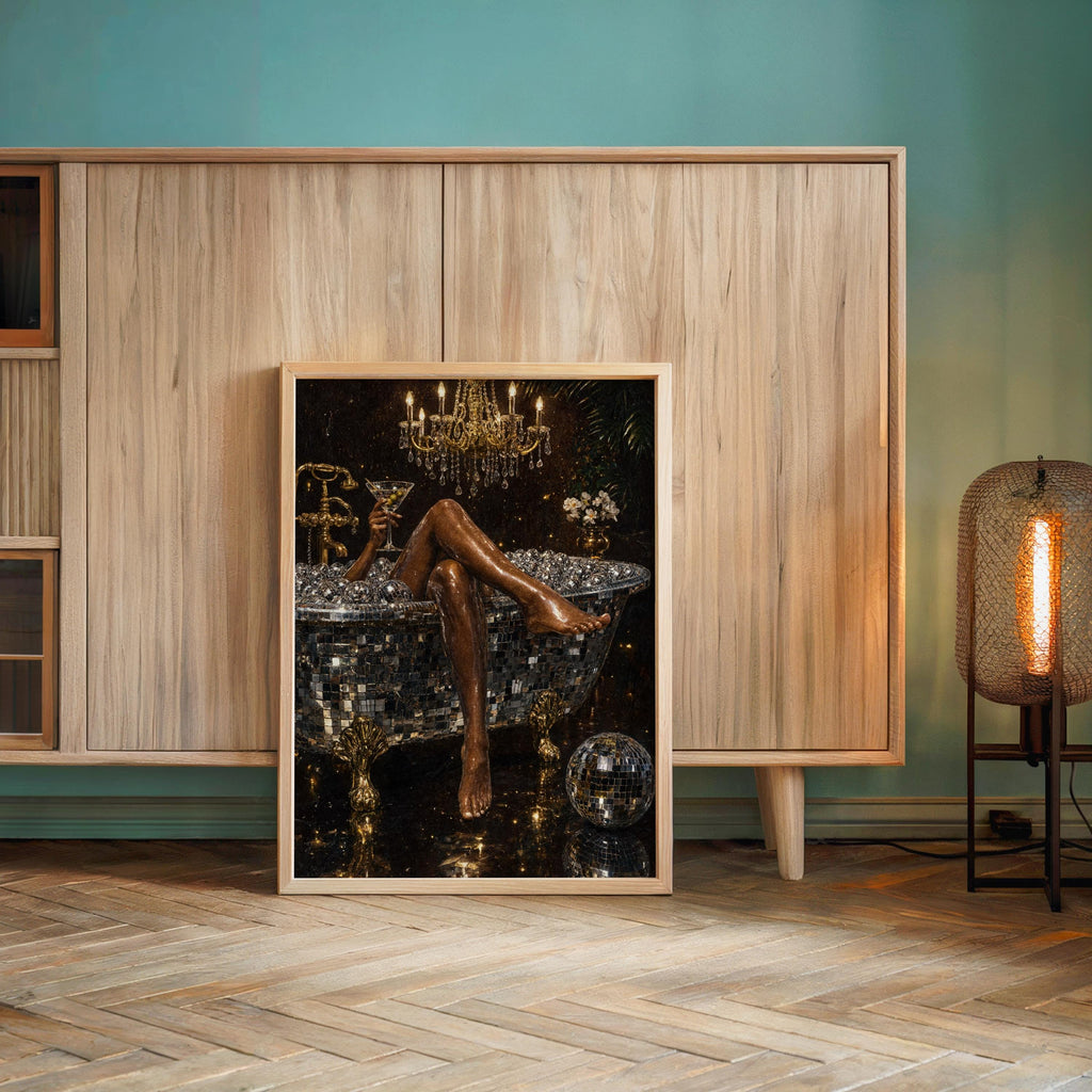 Large framed disco ball bathtub art print resting on the floor against teal and wood paneling, maximalist bathroom wall art energy