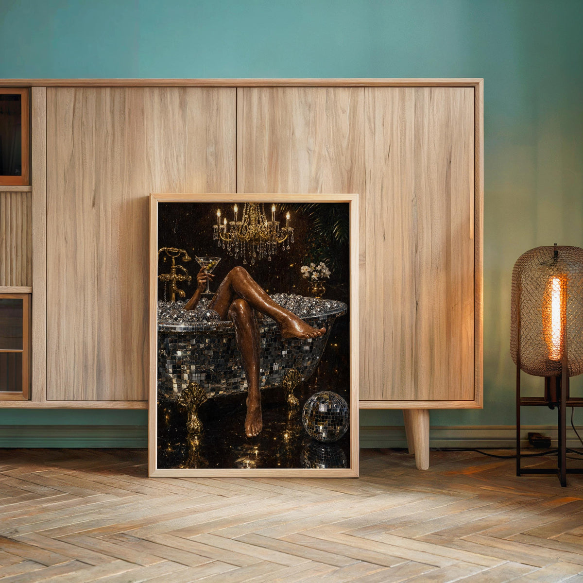 Large framed disco ball bathtub art print resting on the floor against teal and wood paneling, maximalist bathroom wall art energy