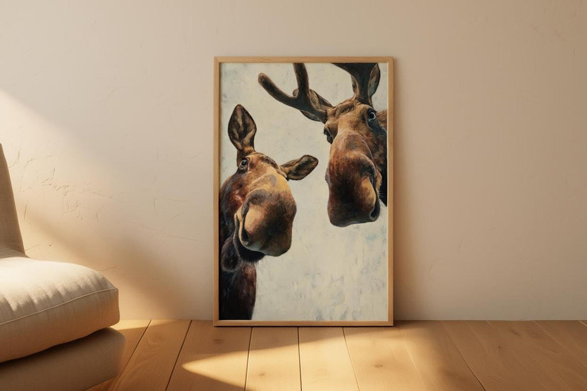 Moose print propped on wood floor next to a pouf, warm morning light highlights painterly texture, funny moose wall art printable