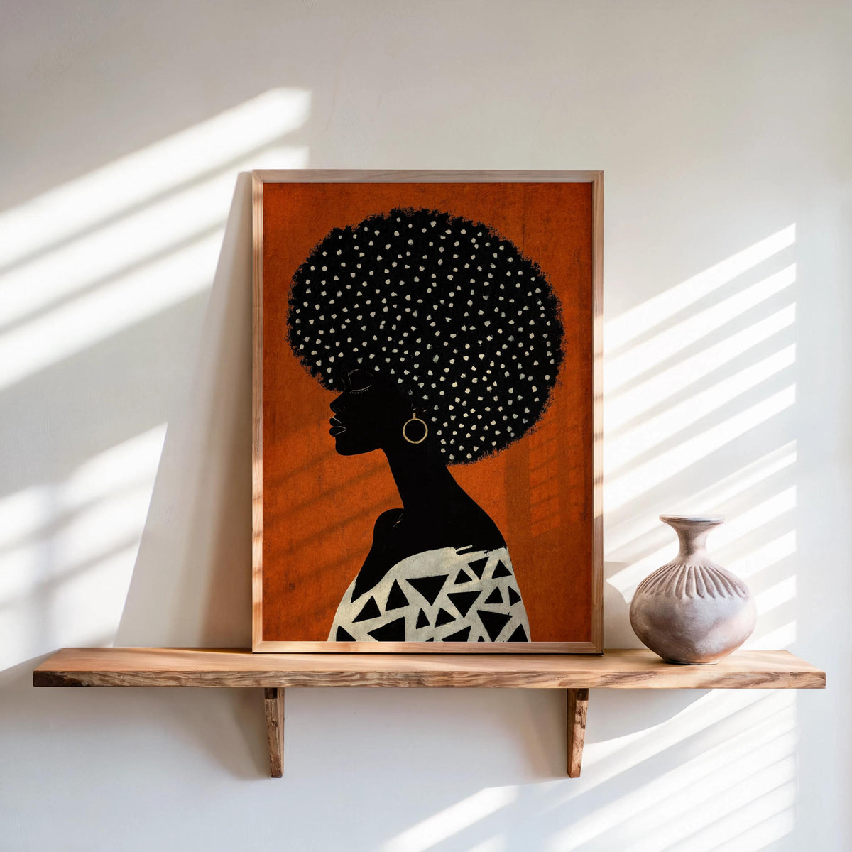 Terracotta orange poster on a wooden shelf, bold silhouette with geometric black-and-white top, Afrocentric Black woman wall art