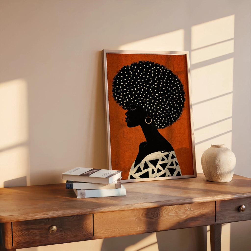 Terracotta orange print on a wooden desk in sunlight, bold profile paired with a graphic black-and-white top, Afrocentric Black woman wall art