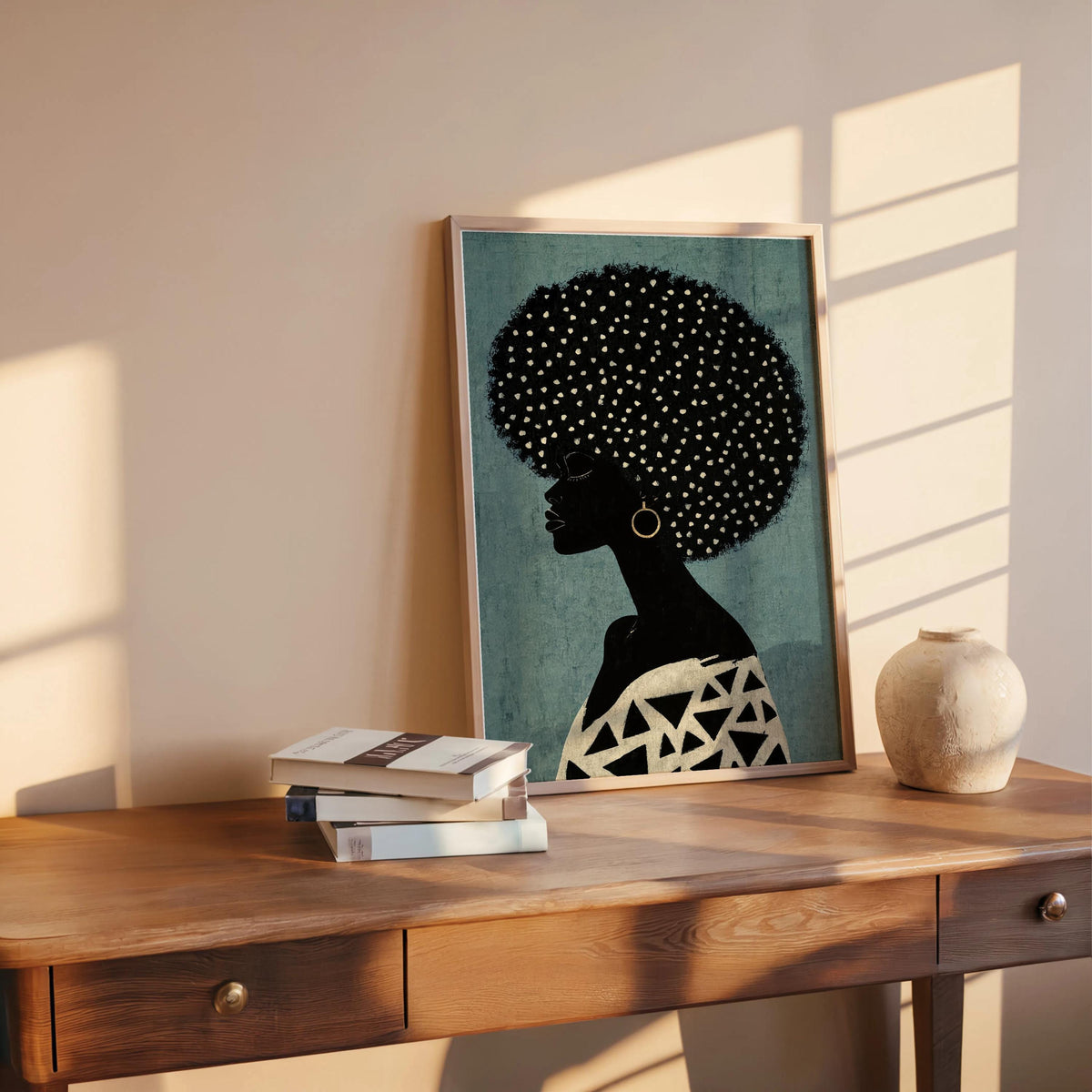 Teal print on a rustic desk in warm sunlight, leaning Afro woman wall decor with dotted afro and patterned top, Afrocentric Black woman wall art