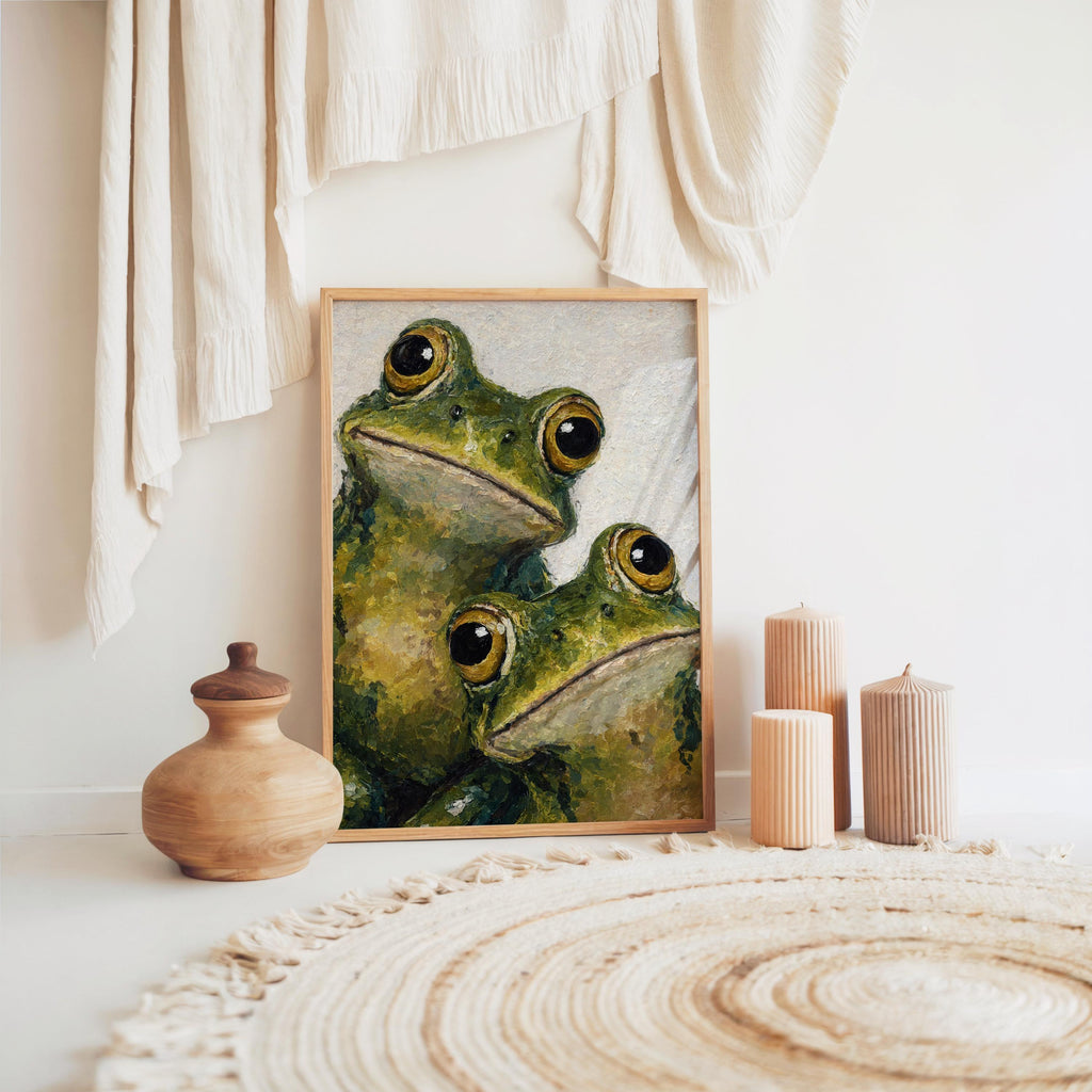 Frog painting print on the floor by woven rug and pottery, neutral tones, quirky expression.