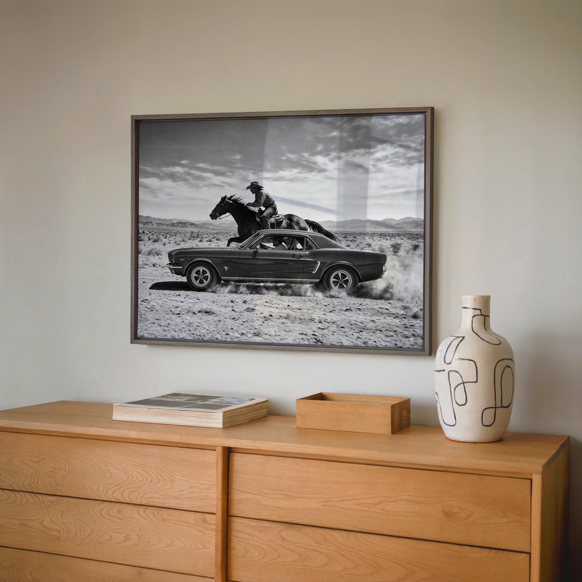 Gray frame Cowboy and Classic Car Wall Art over a low dresser, Man Cave Car Decor meets Americana Wall Decor