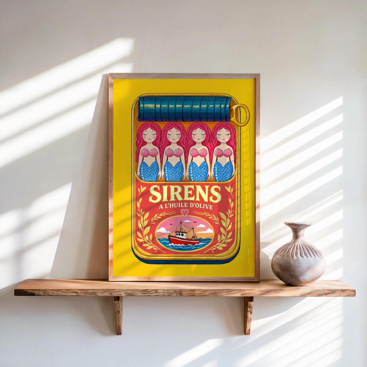 Yellow-framed mermaid sardine tin art print, bright retro colors with pink border, playful kitchen accent