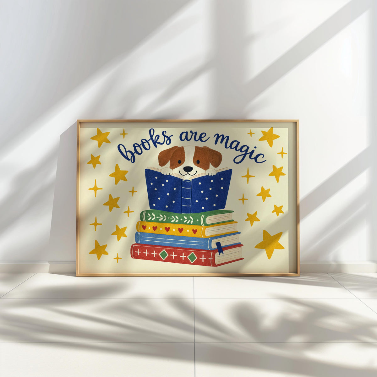 Dog reading wall art on low ledge, long sunlit shadows, 'Books Are Magic' blue, red, green details pop