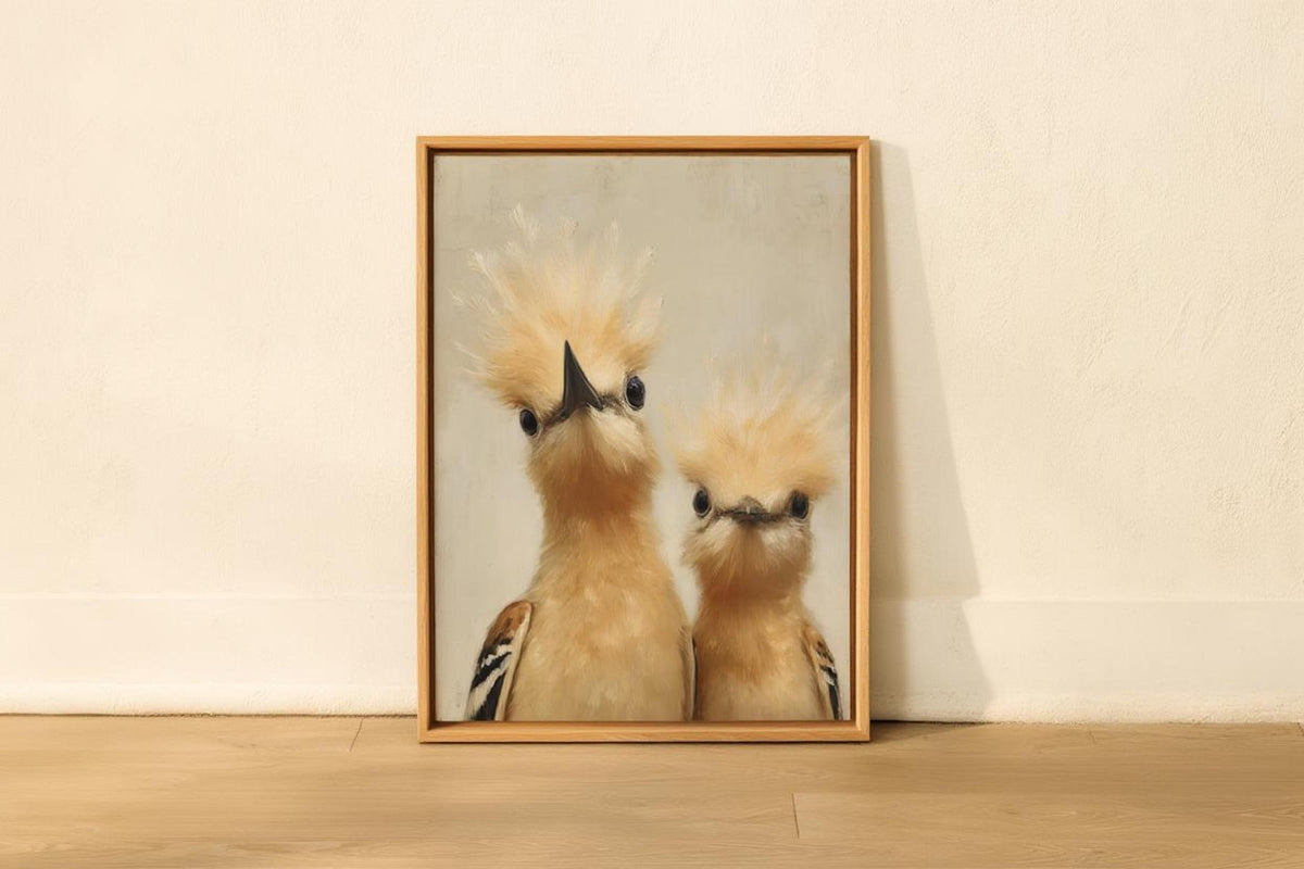 Light wood-framed whimsical bird nursery wall art leaning on a shelf, soft beige backdrop, humorous peeking hoopoes and texture.