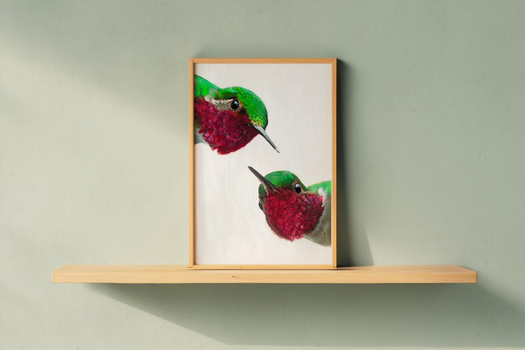 Light-wood framed whimsical hummingbird wall art print on floating shelf, bright tropical bird artwork feel.