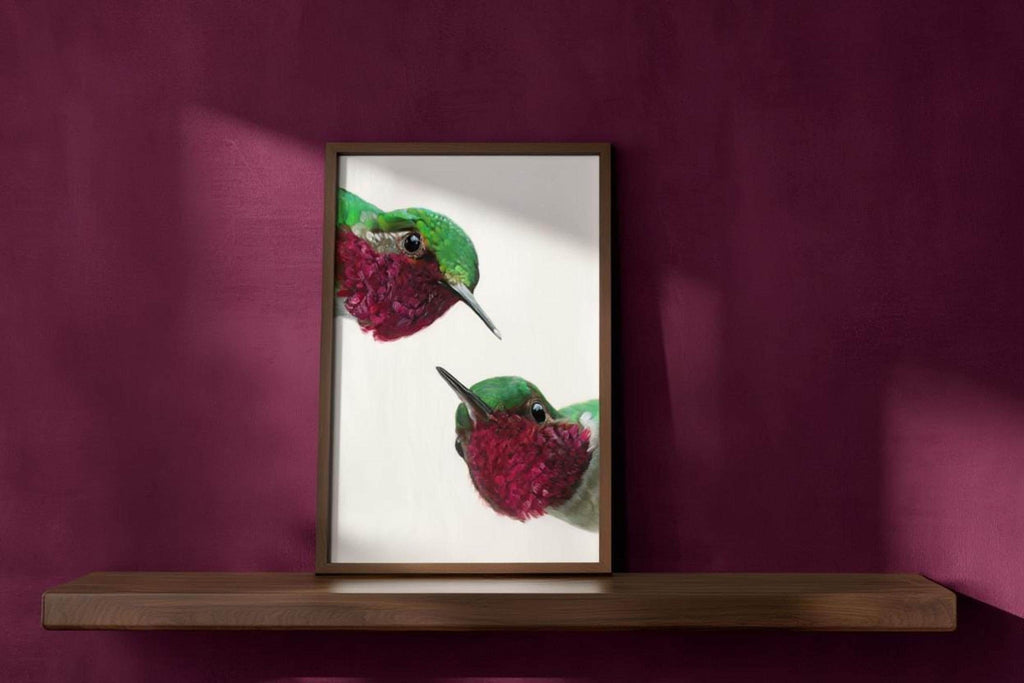 Deep burgundy wall shelf holds whimsical hummingbird wall art print, saturated colors and visible brushstrokes, colorful hummingbird poster.