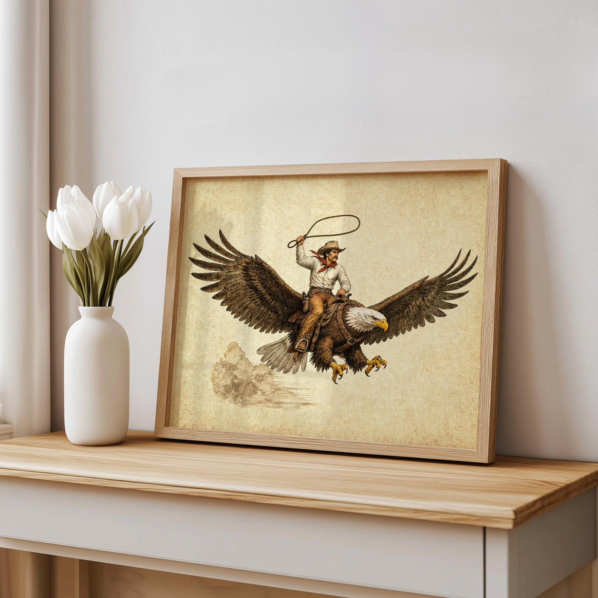 Leaned print on console with vase, physical cowboy riding eagle wall art shown in sepia, rustic frame