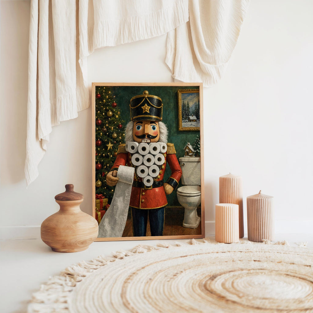 Framed funny nutcracker bathroom print placed near neutral ceramics and a braided rug, cozy powder room vibe.
