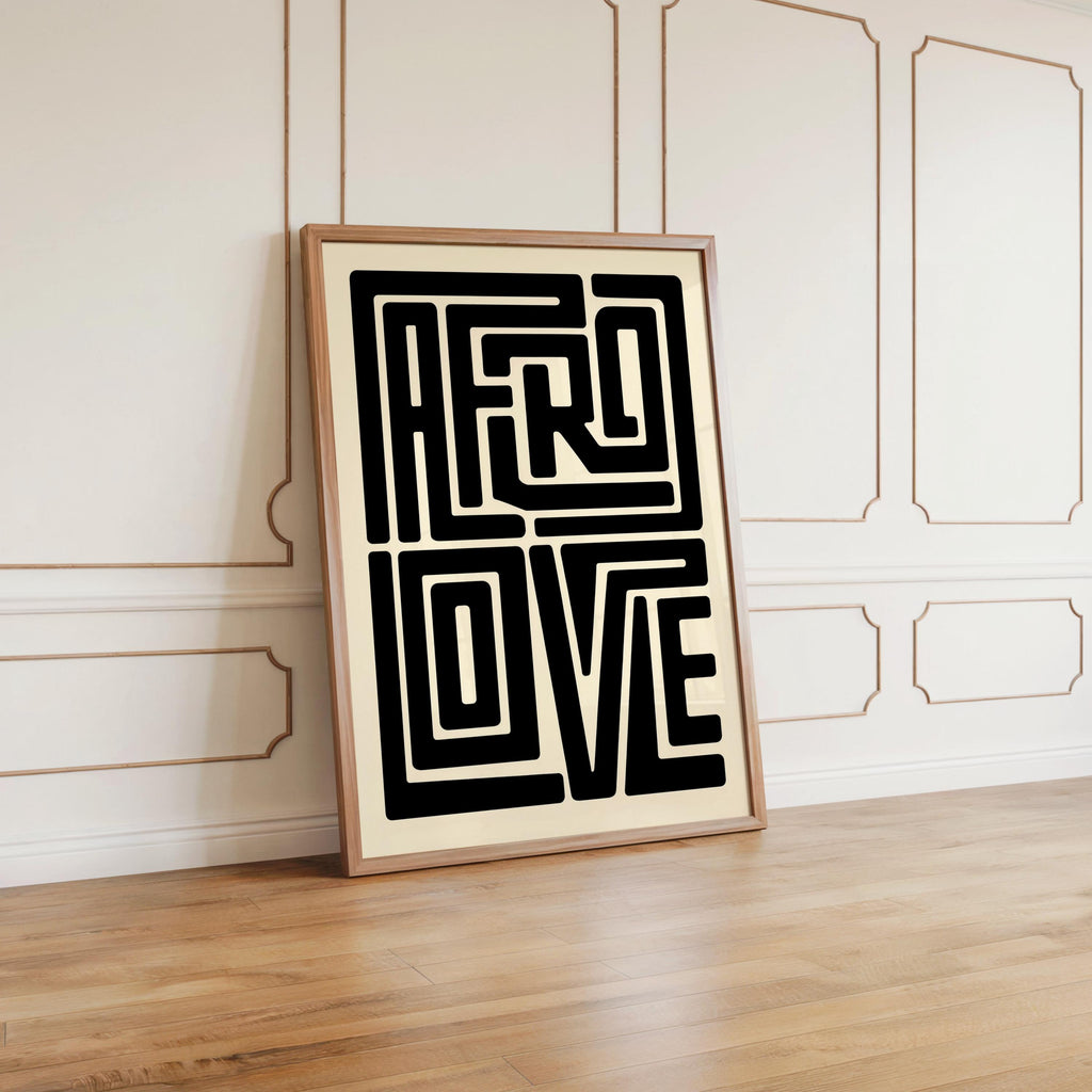 Afro Love wall art large framed print leaning against white paneled wall, warm wood floor, modern styling