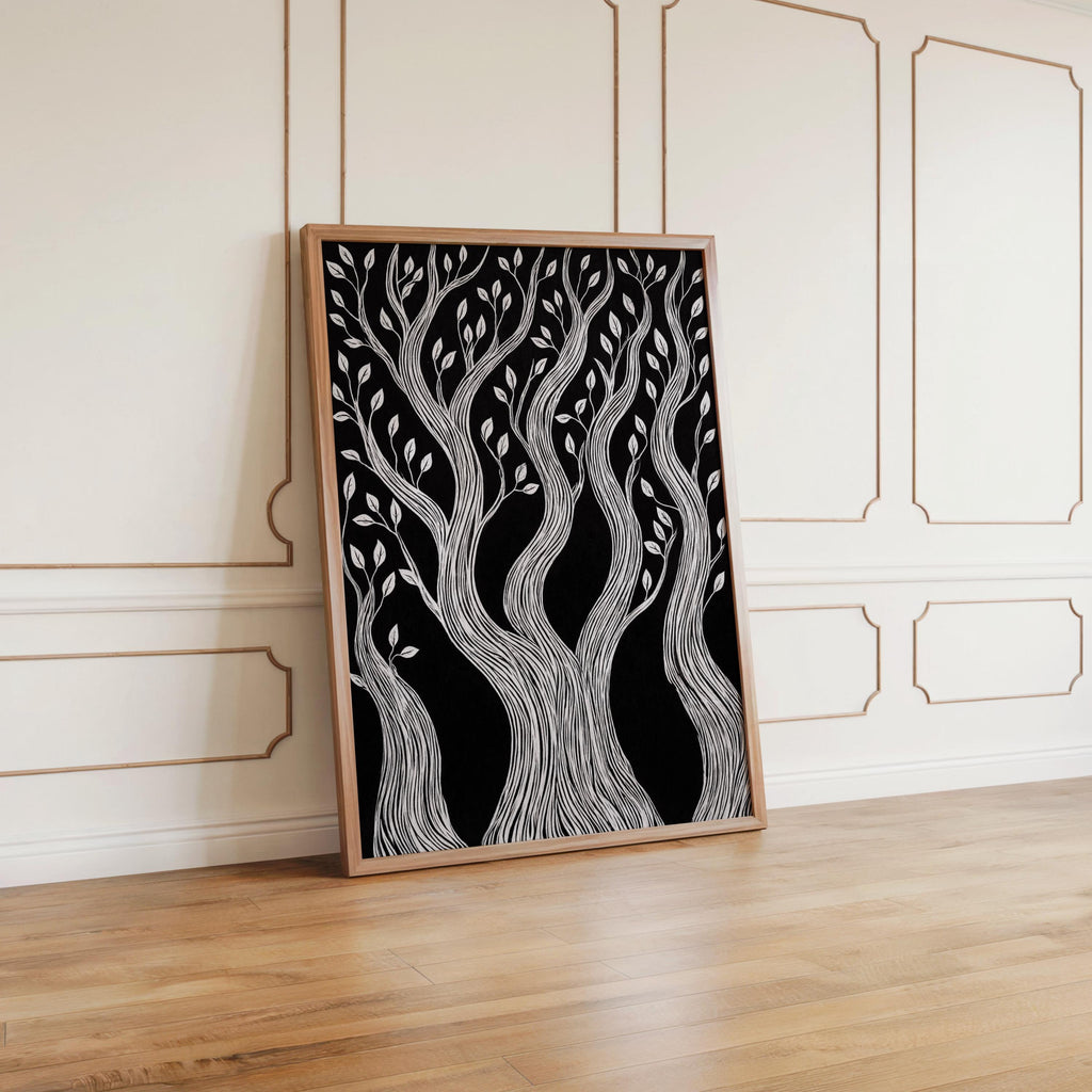 Framed twisted tree wall art leaning against white paneled wall, cabin forest wall art mood, woodcut forest print