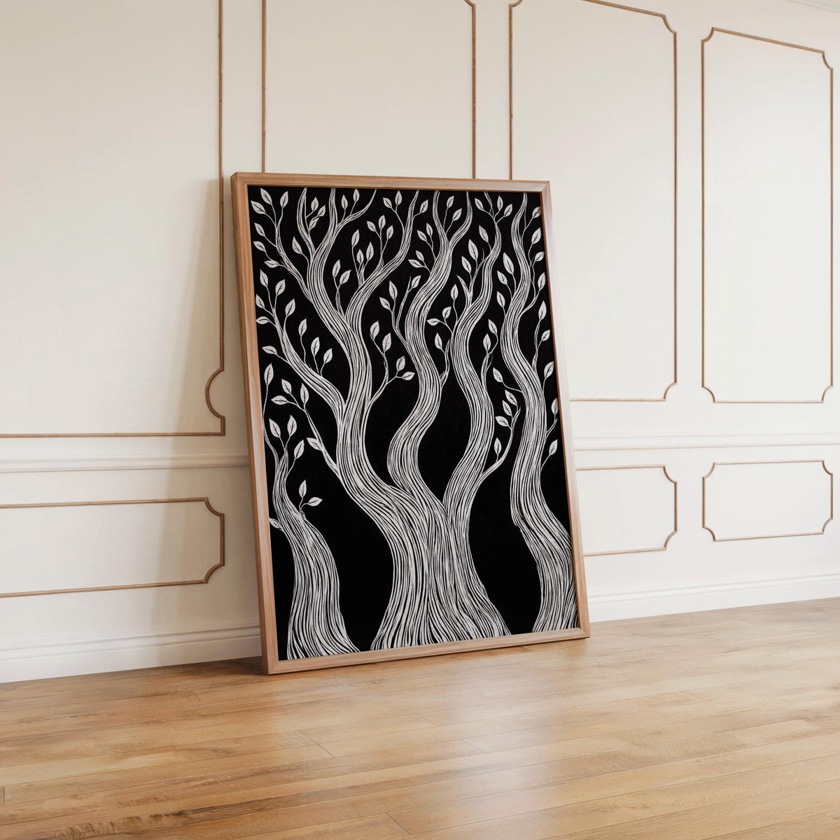 Framed twisted tree wall art leaning against white paneled wall, cabin forest wall art mood, woodcut forest print