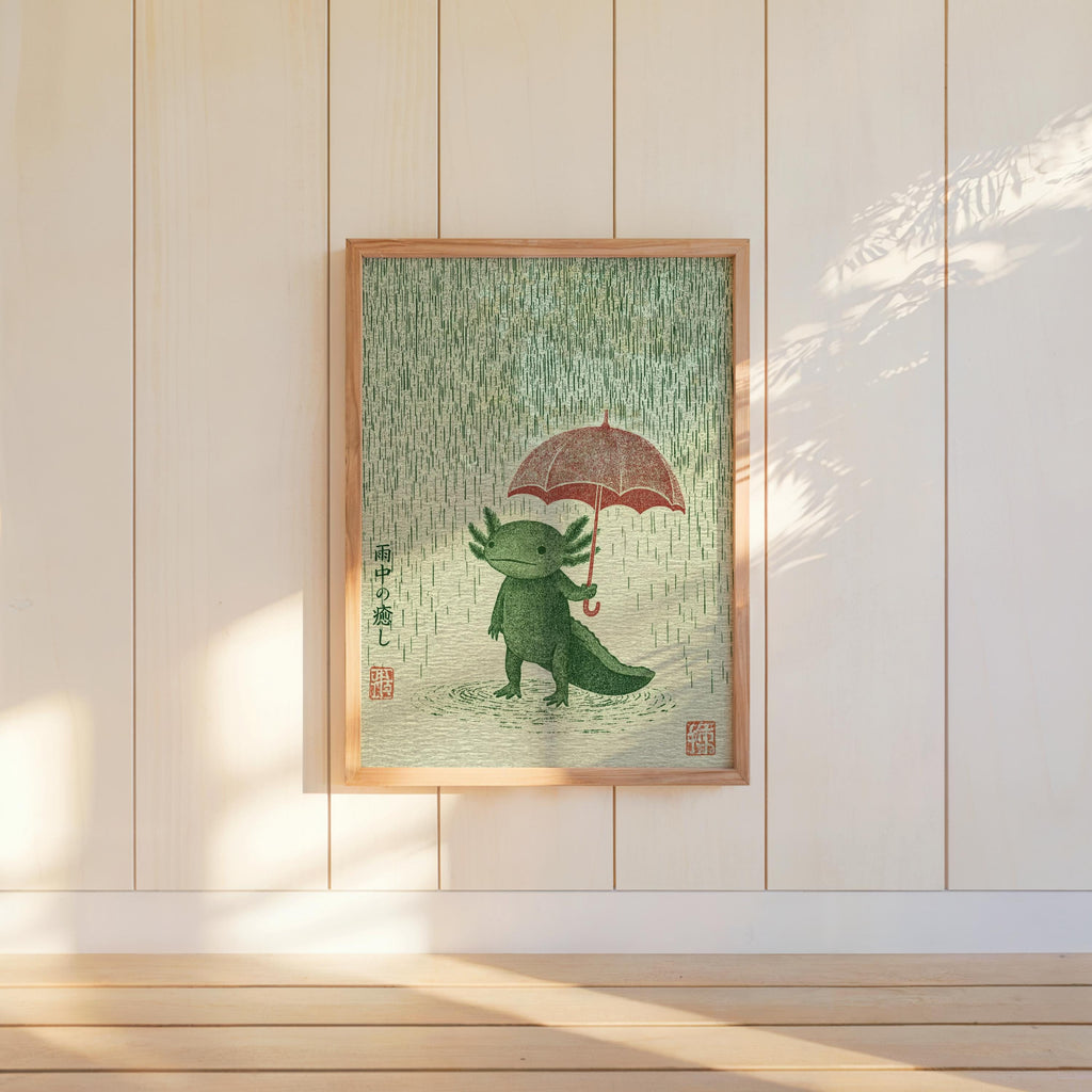 Framed Axolotl Wall Art Print hung on white paneling, long shadows, kawaii green axolotl with umbrella in rain