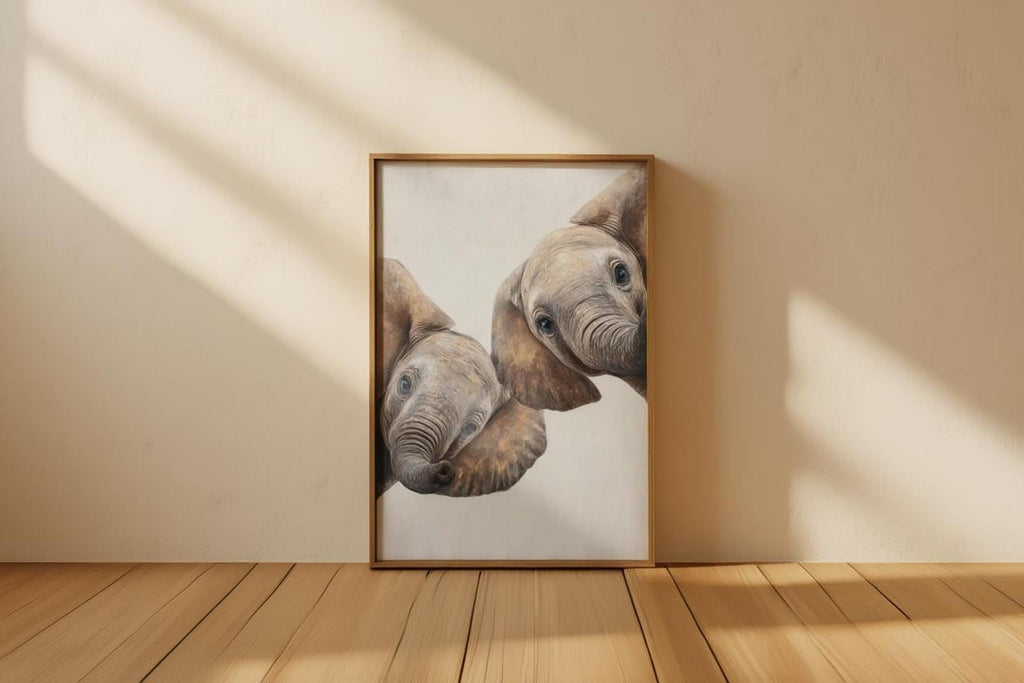 Leaning frame on light wood floor, peeking elephant wall art print with strong sunlit shadows and neutrals