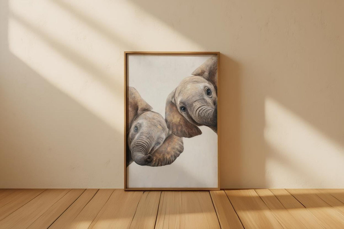 Leaning frame on light wood floor, peeking elephant wall art print with strong sunlit shadows and neutrals