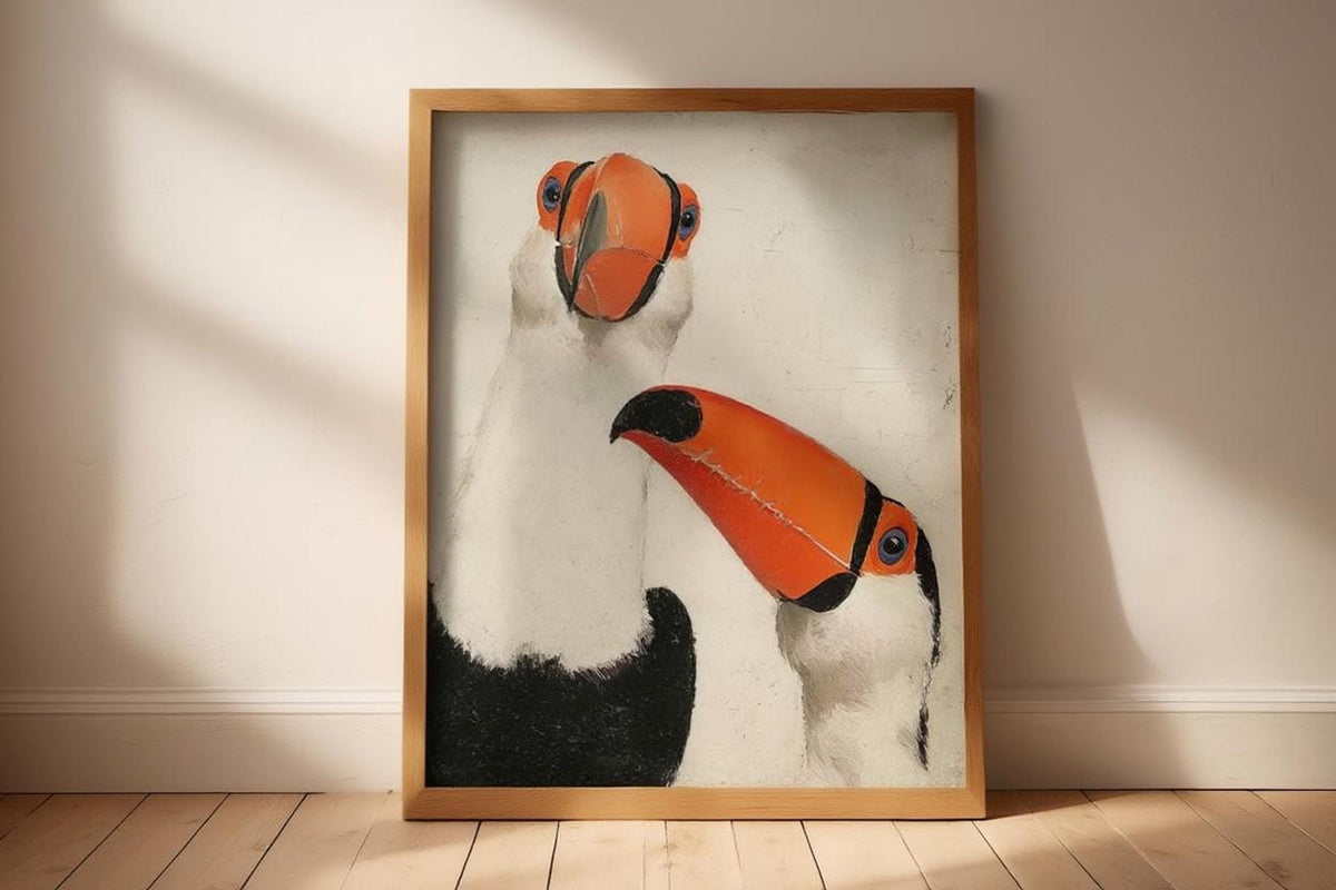 Large wooden-framed toucan wall art print standing on floor against off-white wall, whimsical bird wall art