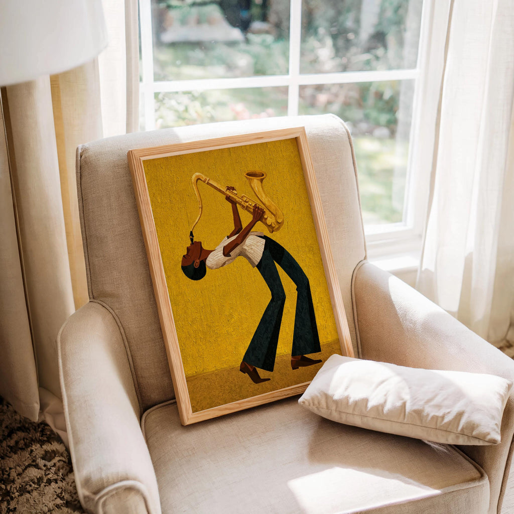 Afrocentric jazz wall art print on armchair, mustard yellow canvas, dramatic bent sax player, textured finish.