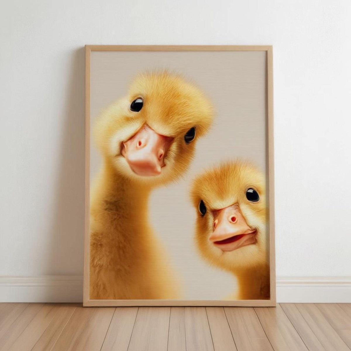 Framed wooden print leaning on floor, two peeking goslings, warm yellow tones, baby goose nursery wall art